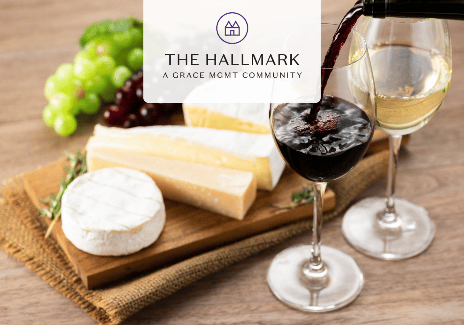 Brand banner: The Hallmark logo over a wine and cheese board (red and white wine being poured) with grapes and Brie on a wooden table in the background.